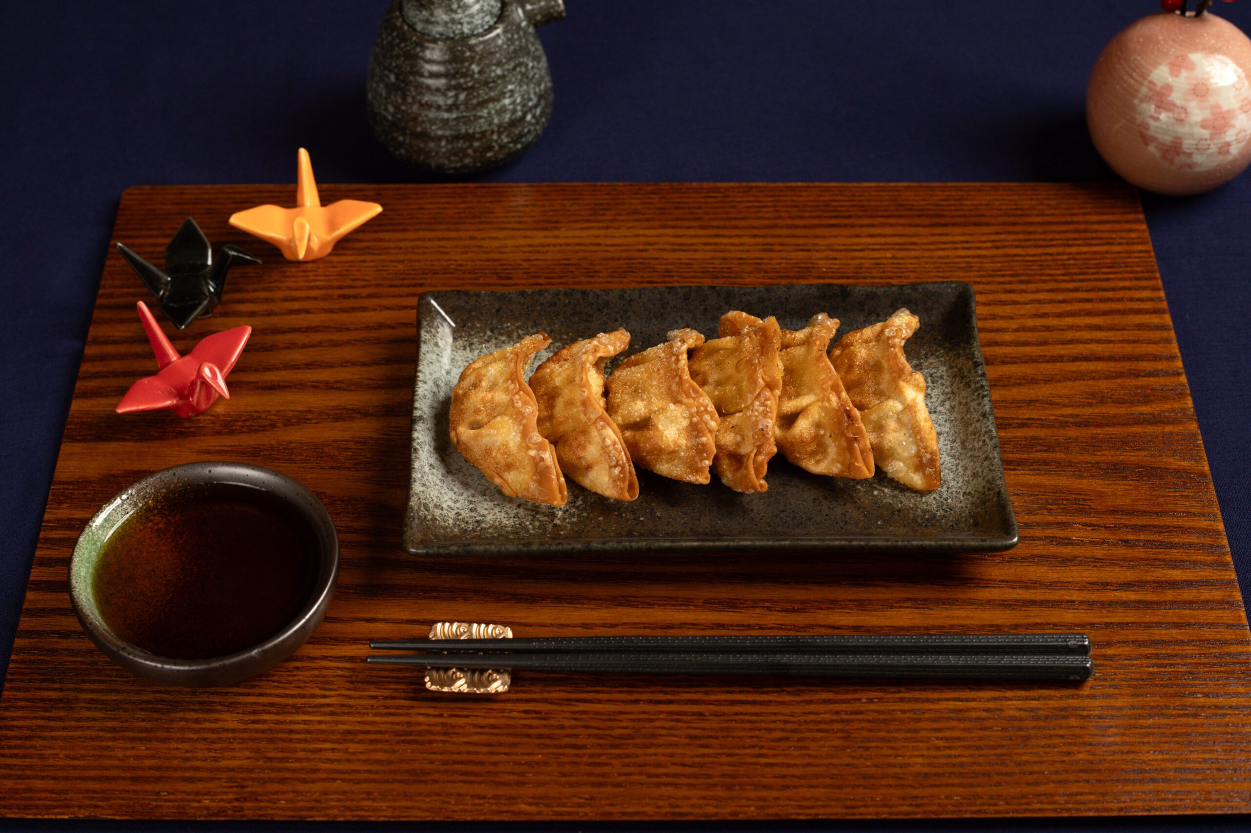 Crispy and golden Japanese dumplings, filled with a flavorful mix of ground meat, cabbage, garlic, and ginger, served at Inari Grill, the best Japanese restaurant in LA